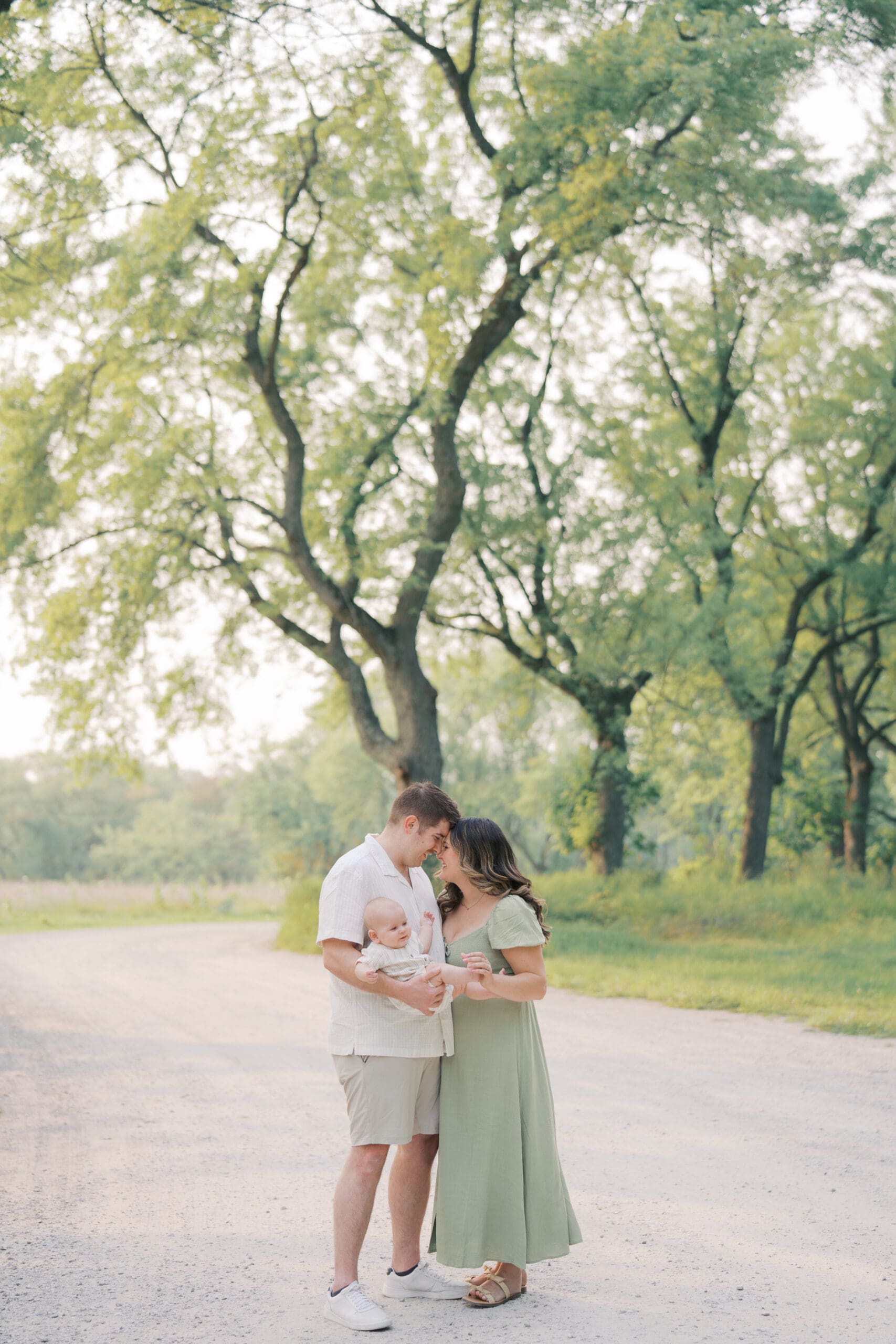 young family tickling their little baby boy during a sessions