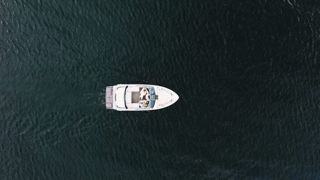 Drone photographer of a family during their session on a lake.