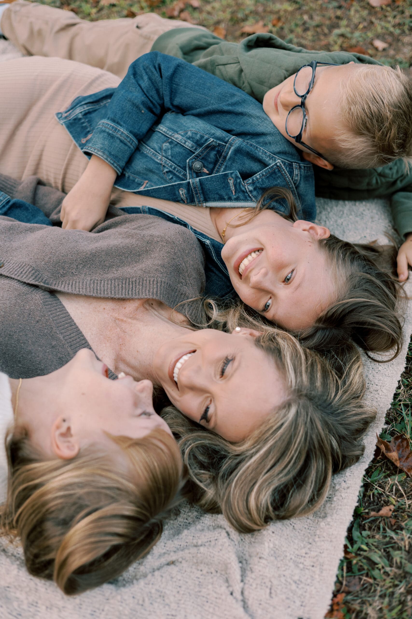 Dallas family photographer guiding extended family members during outdoor photo shoot