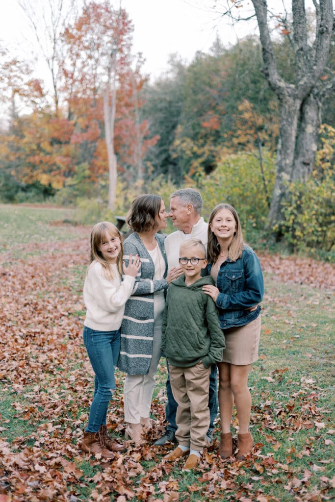 Dallas family photographer guiding extended family members during outdoor photo shoot